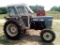 560 LONG ENCLOSED CAB TRACTOR, 5075 HOURS SHOWING, RUN/DRIVES