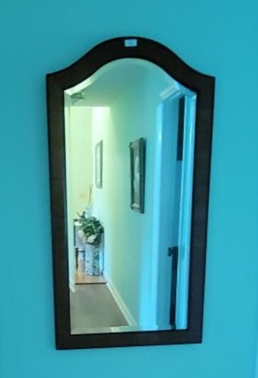 TALL WOODEN FRAMED MIRROR HANGING ON WALL