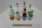 Assortment of glass bottle sprinklers, one painted