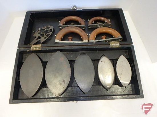 Enterprise set of sad irons in wooden box with dovetailed corners