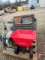 Broadcast spreader, garden hose and cart, wood shop creeper, metal and plastic fuel cans