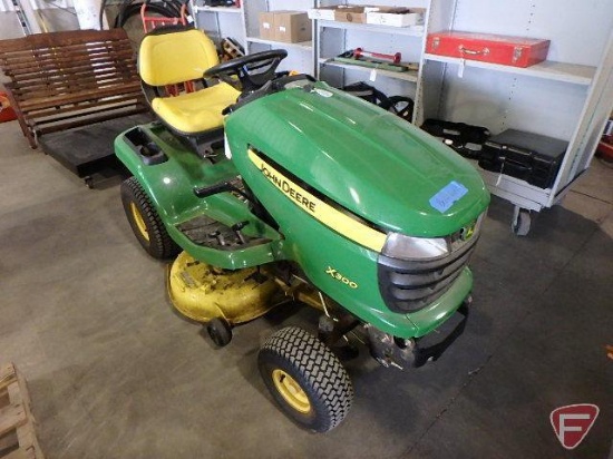John Deere X300 lawn tractor with 42" mowing deck, 149.8 hours showing, Kawasaki 472cc gas engine