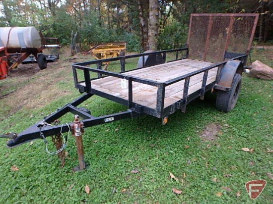 Single axle, flatbed trailer with expanded metal drop ramp 64X50, 10in side railing, wood deck,