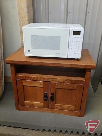 GE Turntable microwave, under the counter, and wood storage cabinet with two drawers