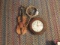 Violin, Seth Thomas wall clock, and tambourine