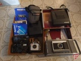 Cameras: Polaroid, Olympus, Brownie, and others; all film