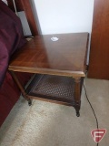 Small occasional walnut table, on wheels