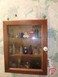 Wall cabinet with miniature perfume and other bottles