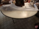 Round banquet table with folding legs, 67in dia.