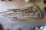 Old yard tools: (2) scythes, 5 tine fishing spear, maul, axes, pick ax head, bicycle pump,