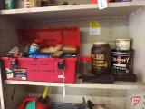 Contents of shelf: Toolbox with chainsaw chains, spark plugs, spark plug wrenches,