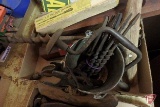 Old valve tool, auger bits, levels, ratchet screw driver, pipe, and tin can