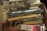 Fold up rulers, ax head, clippers, pipe wrenches