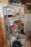 Shelf and contents: paint brushes, wall paper brushes, paint rollers, cement trowels, drain