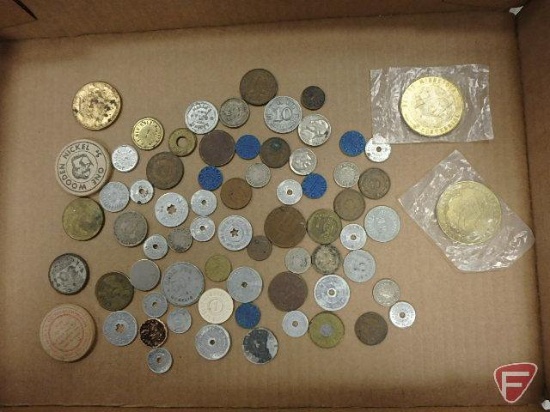 An assortment of tokens; Benson Centennial and others