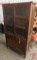 Wood storage cabinet with tin inserts, 2 drawer, 4 door, front doors need to be re-installed