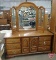 Wood dresser with tri-fold mirror, 6 drawers 2 doors, 80inHx70inWx19inD, and headboard 63inW