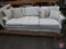 Three cushion sofa with asst. of pillows, 86inL