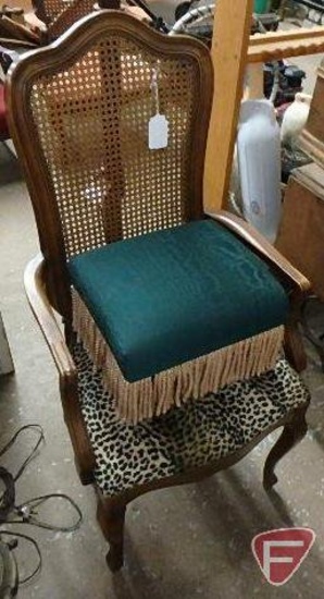 Upholstered cane back arm chair and upholstered foot stool with fringe, Both