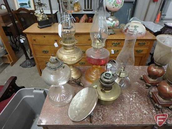 Oil lamps and parts in tote