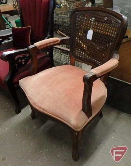 Upholstered cane back arm chair, shows some wear/fading