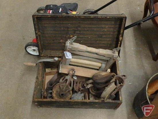 Pulleys and hand wringer in vintage suitcase