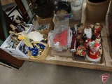 Christmas items, Santa figurines, plates, cookie cutters, glass mugs, ornaments, and