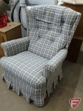 Upholstered rocking and reclining chair with throw pillows