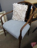 Upholstered chair with pillow
