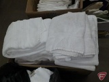 White bath towels, plastic bag and box