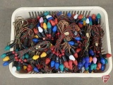 Vintage Christmas lights, some on cloth cord and some with red wood beads in plastic basket