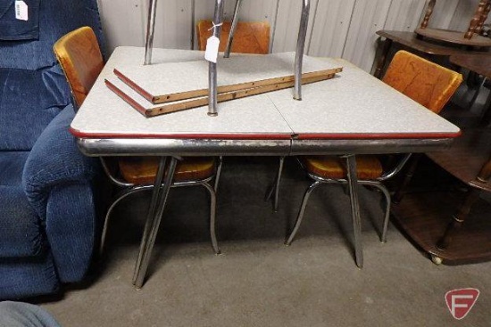 Vintage metal table 47inX36x with some staining, (2) 12 in leaves, and (4) metal chairs,