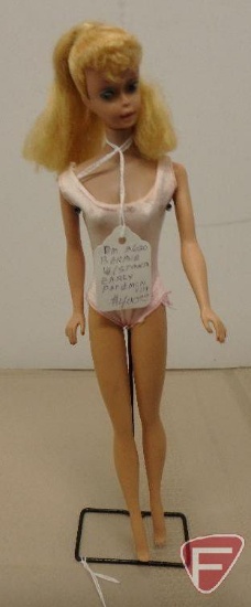 Signed Mattel Barbie with stand, has some damage on breasts