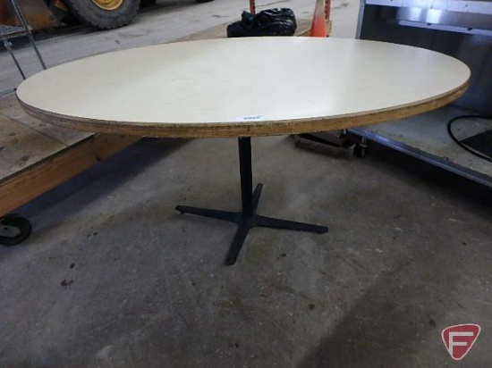 Oval table with metal base