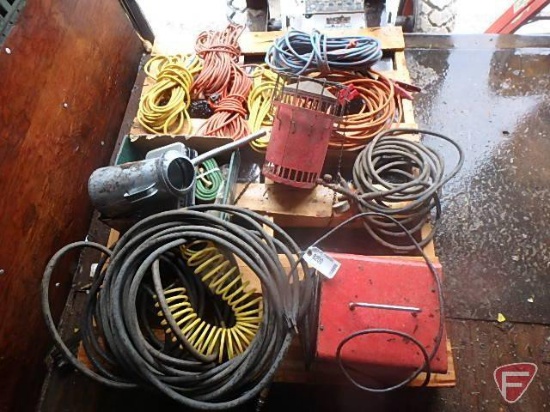 Contents of pallet: extension cords, battery charger, air hoses, heater, oil can, and more