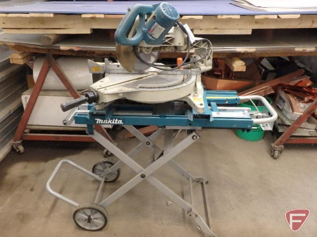Makita LS1013 miter saw on Makita portable miter saw stand | Heavy  Construction Equipment Light Equipment & Support Saws Miter Saws -  Professional | Online Auctions | Proxibid