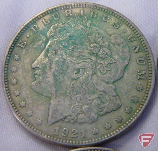 (8) 1921 PD or S Morgan silver dollars, all have varying amounts of PVC