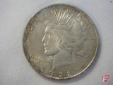1922 slightly toned Peace dollar, uncirculated condition
