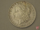 1884 New Orleans silver dollar, AU55 to AU58