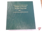 Nice Littleton green folder of American silver eagles with 1986, 1987, 1991, 1993, 1995, key