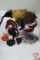 Assortment of decorative feathers and masquerade masks, in tote with cover
