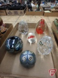 Glass paperweights and metallic vase