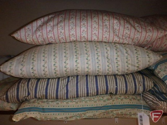 Feather pillows and blanket, all on shelf