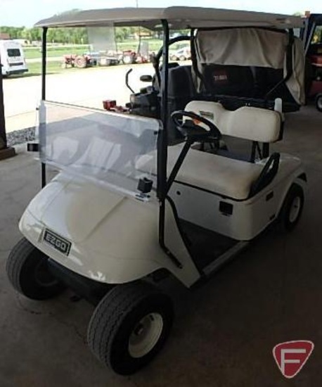 EZ-GO TXT electric golf car, white, has windshield, canopy, rain curtain, charger, SN: 2624655