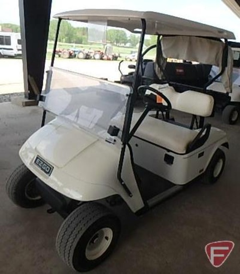 EZ-GO TXT electric golf car, white, has windshield, canopy, rain curtain, charger, SN: 2623897