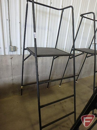 Folding metal ladder with platforms; platform stands approx. 48in off floor