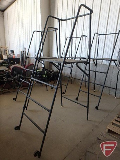 Folding metal ladder with platforms; platform stands approx. 48in off floor