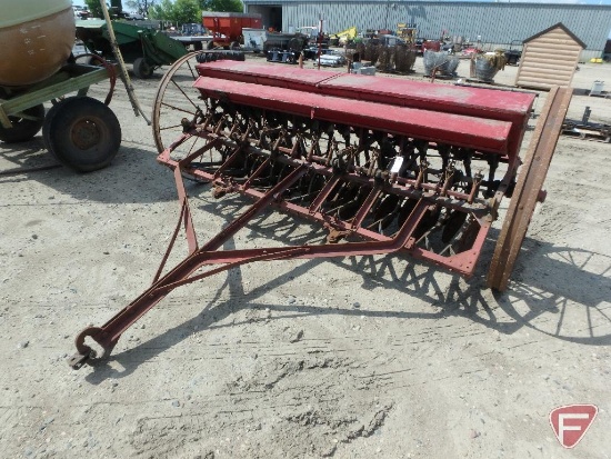 McCormick Deering grain drill with grass seeder, approx 10 ft. used for planting oats