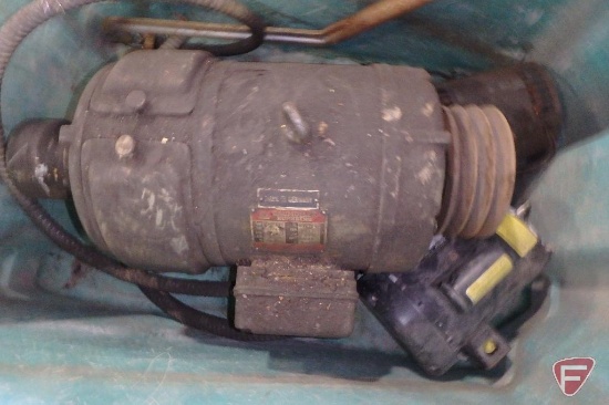 Old electric motors in fiberglass bin