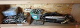 Contents of shelf: grease guns, oil filter wrenches, spray nozzle, pegboard tool holders,